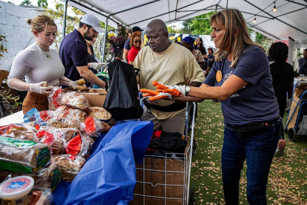 Food Rescue US volunteers in Miami arrange food on a table