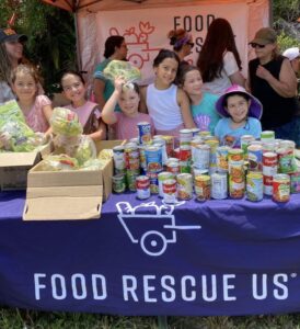 Children educating the public about Food Rescue US.