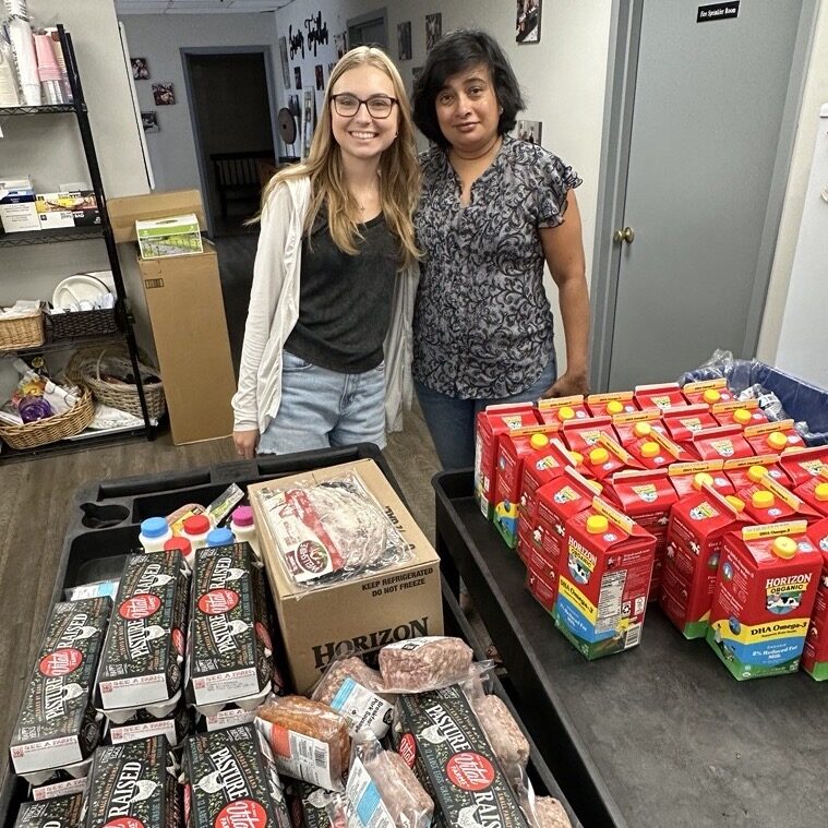 Food Rescue US Nassau County Site Director Madhu with partner and donated food