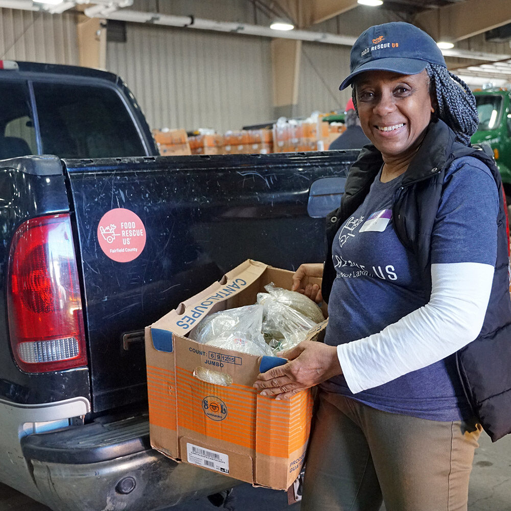 Food Rescue US - Fairfield County volunteer with box of melons