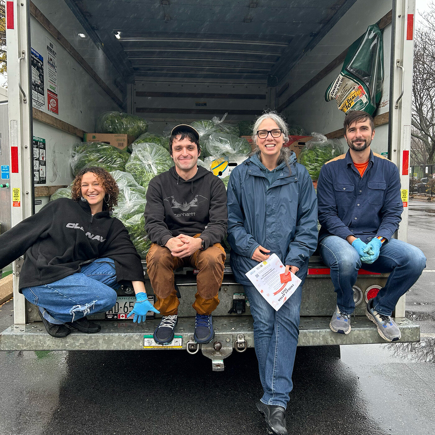 FRUS Boston Site DIrecor Charlie Burns in back of truck with volunteers